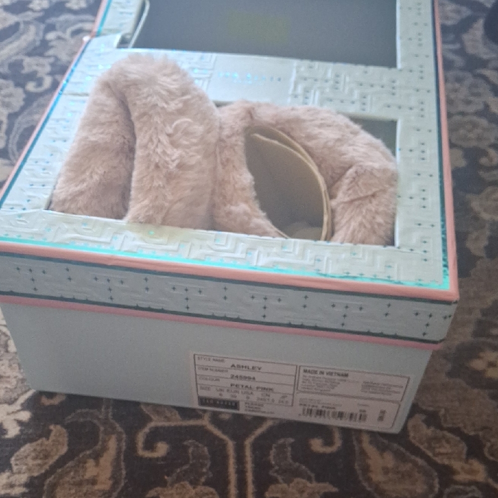 Soft plush fuzzy boots in a petal pink shade.